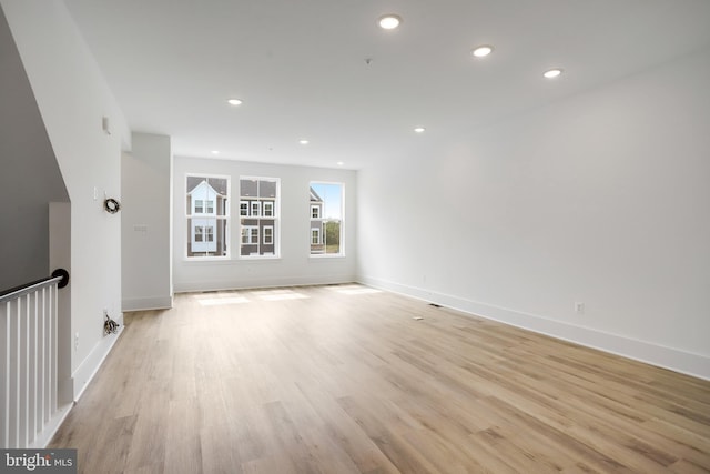 spare room featuring light hardwood / wood-style floors