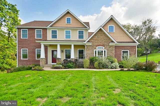 craftsman-style house with a porch and a front yard