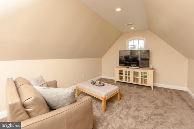 living room featuring vaulted ceiling and carpet flooring