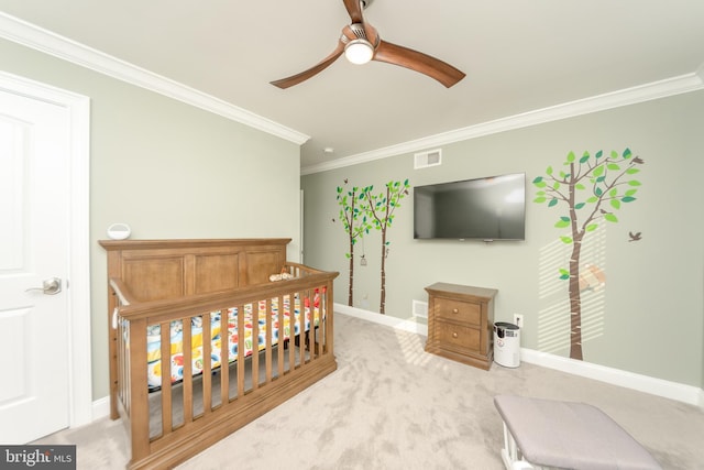 carpeted bedroom with crown molding and ceiling fan