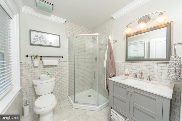 bathroom featuring ornamental molding, tile walls, and walk in shower