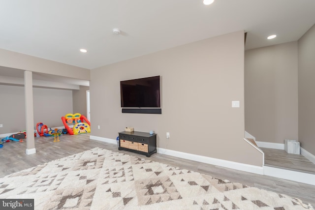 game room with light wood-type flooring