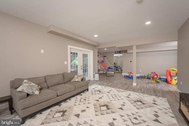 living room with light hardwood / wood-style floors and french doors