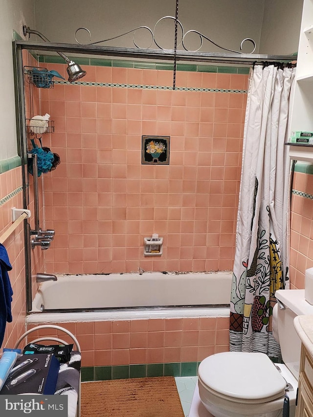 full bathroom featuring tile patterned floors, vanity, toilet, and shower / tub combo