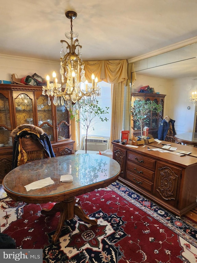 dining room with crown molding, an inviting chandelier, and a wall unit AC