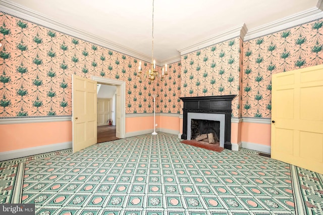 unfurnished living room featuring ornamental molding and a fireplace