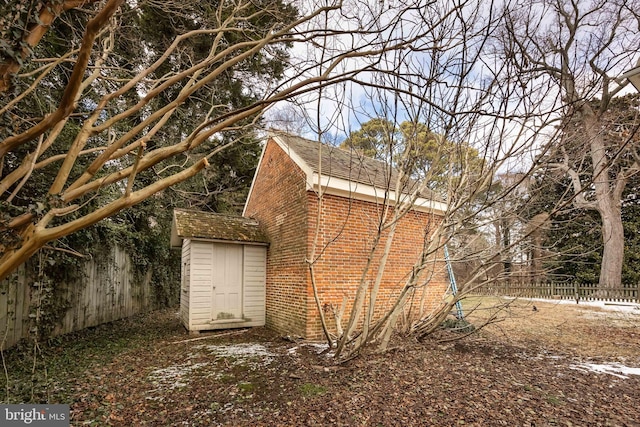 exterior space featuring a shed