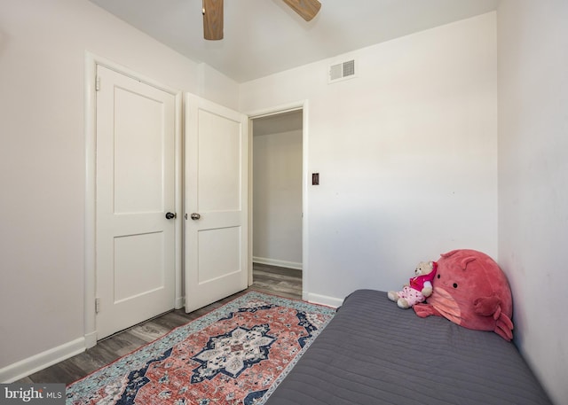 bedroom featuring dark hardwood / wood-style flooring and ceiling fan