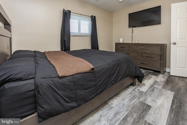 bedroom with wood-type flooring