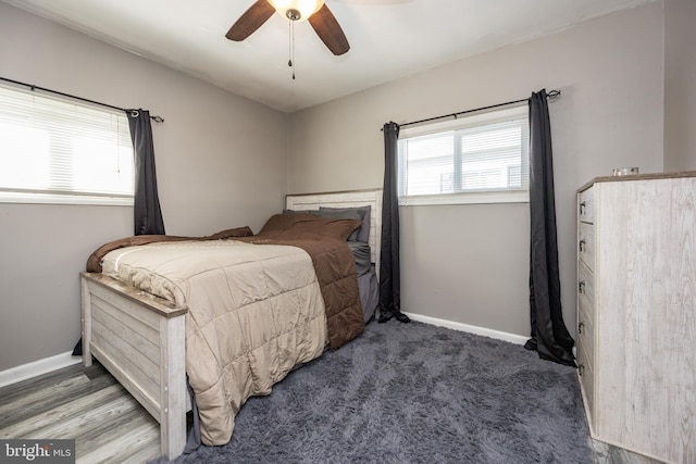 bedroom with ceiling fan and carpet floors