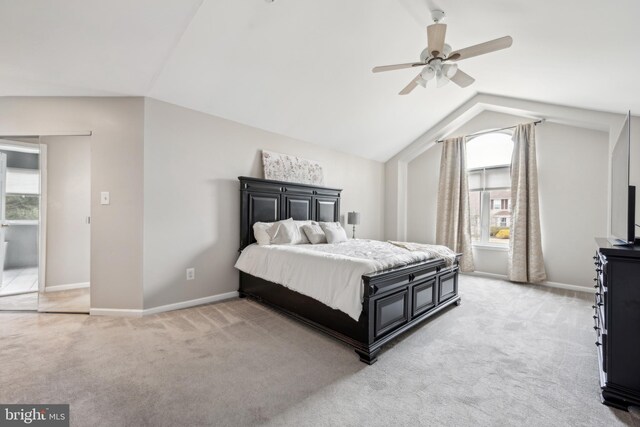 carpeted bedroom featuring ceiling fan and lofted ceiling
