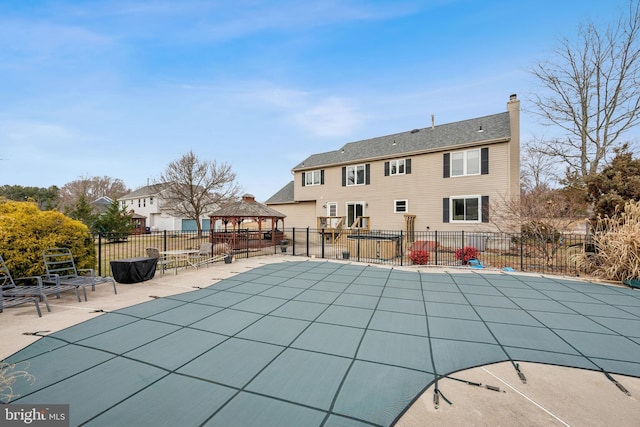 view of pool featuring a gazebo and a patio area