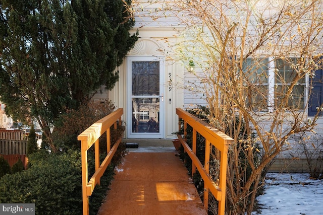 view of snow covered property entrance