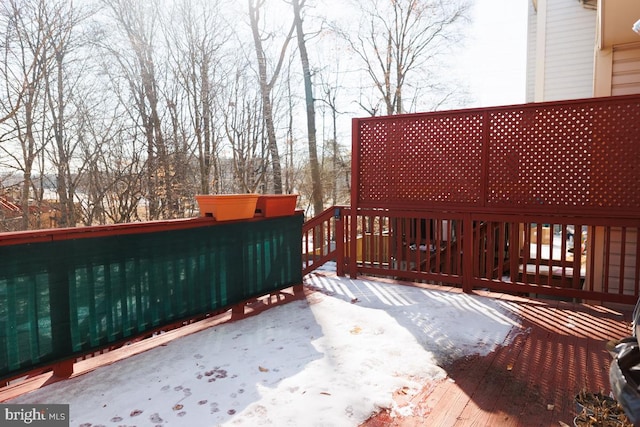 view of snow covered deck