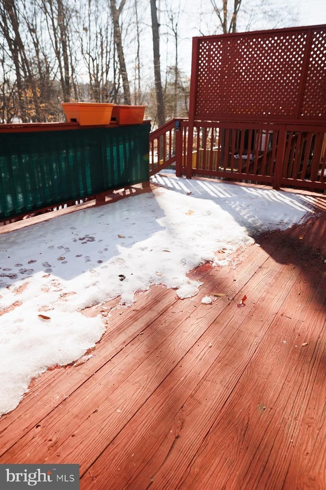 view of snow covered deck