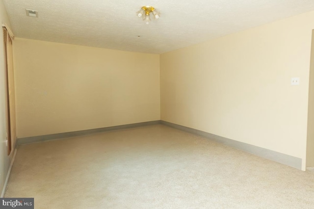 empty room with a textured ceiling