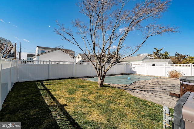 view of yard with a fenced in pool, a patio area, and a fenced backyard