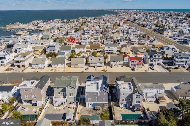 bird's eye view featuring a residential view and a water view