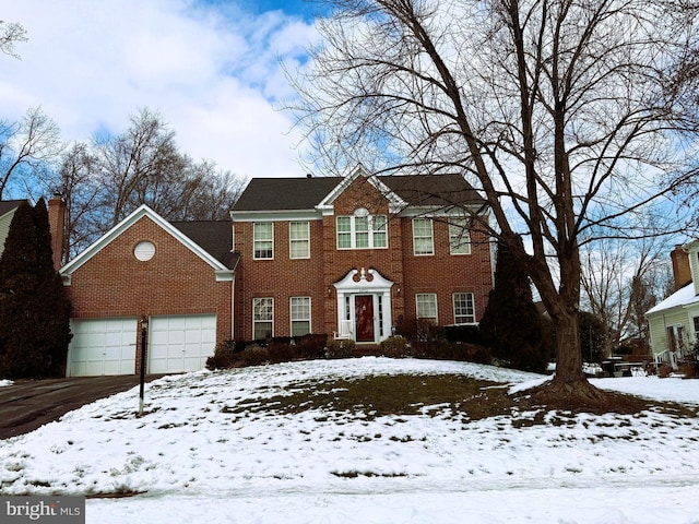 colonial house featuring a garage