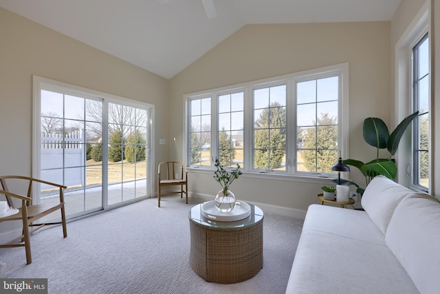 sitting room with lofted ceiling and carpet floors