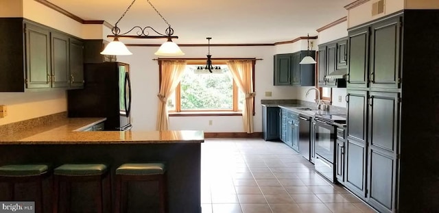 kitchen featuring dishwasher, hanging light fixtures, electric range, kitchen peninsula, and black fridge