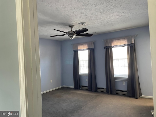 unfurnished room with a baseboard heating unit, carpet flooring, and ceiling fan