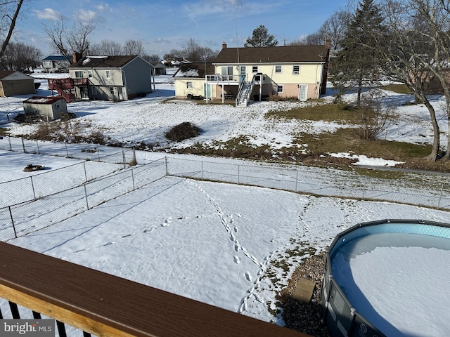 view of yard layered in snow