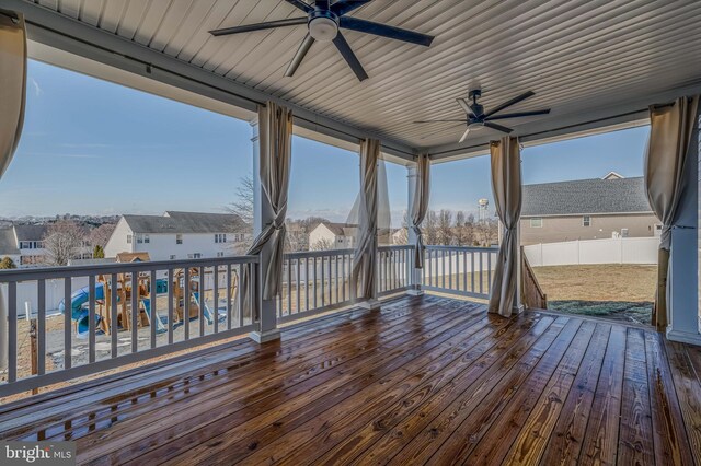 wooden deck featuring ceiling fan