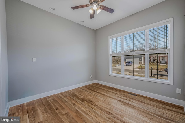 unfurnished room featuring ceiling fan and light wood-type flooring