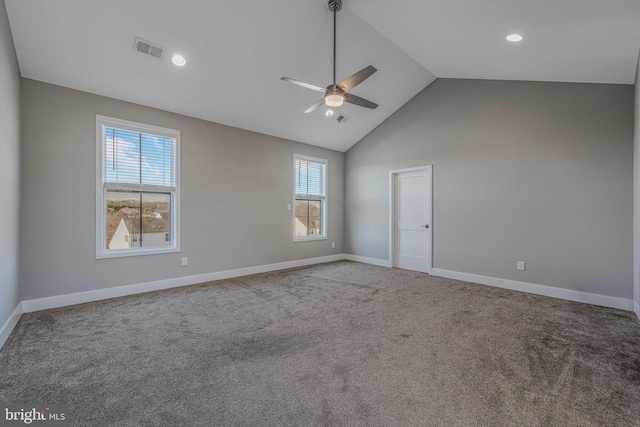 unfurnished room with high vaulted ceiling, ceiling fan, and carpet