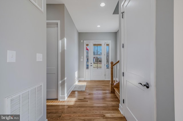 hall with light hardwood / wood-style floors