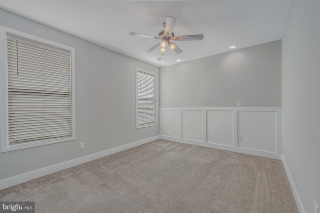 carpeted empty room with ceiling fan