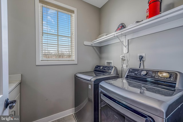 washroom with separate washer and dryer and hardwood / wood-style flooring