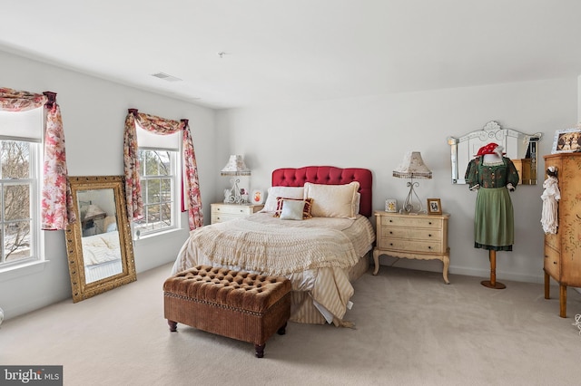 bedroom with light colored carpet