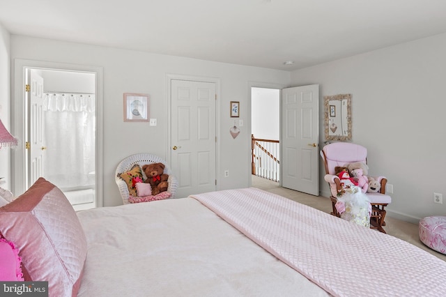 bedroom with light colored carpet