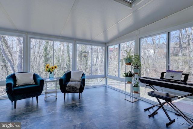 sunroom featuring lofted ceiling