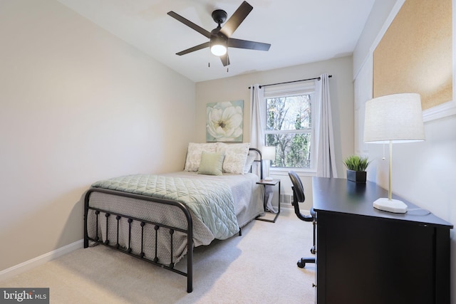 bedroom featuring visible vents, a ceiling fan, baseboards, and carpet floors