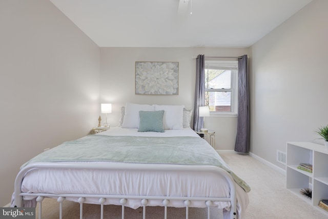 bedroom with visible vents, carpet floors, and baseboards