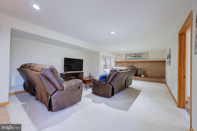 living area with recessed lighting, light colored carpet, and baseboards