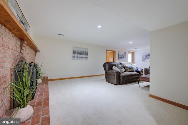 carpeted living room with visible vents, recessed lighting, a fireplace, and baseboards