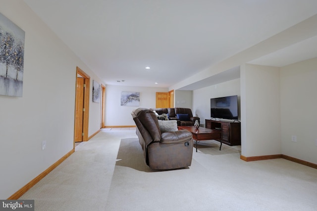 living area featuring recessed lighting, light colored carpet, and baseboards