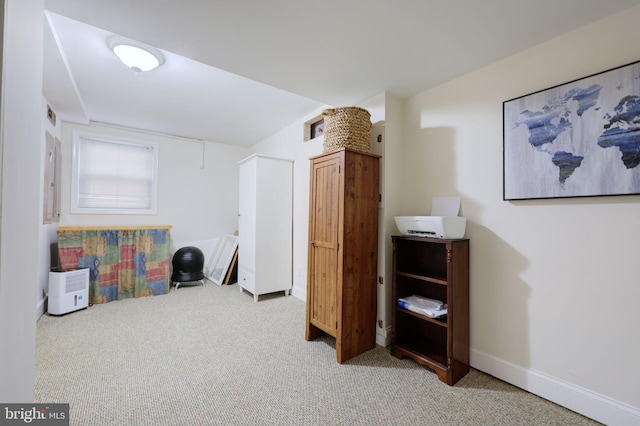 interior space with carpet and baseboards