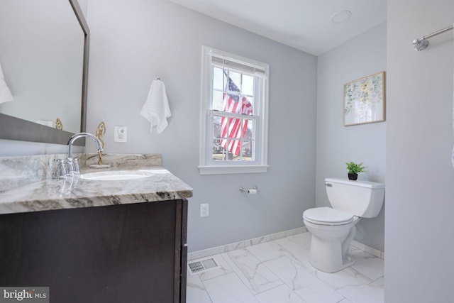 half bath featuring vanity, visible vents, baseboards, toilet, and marble finish floor