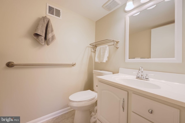 half bath with vanity, toilet, baseboards, and visible vents