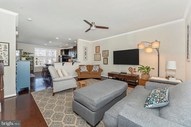 living room featuring crown molding, ceiling fan, and dark hardwood / wood-style floors