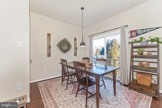 dining area featuring dark hardwood / wood-style floors