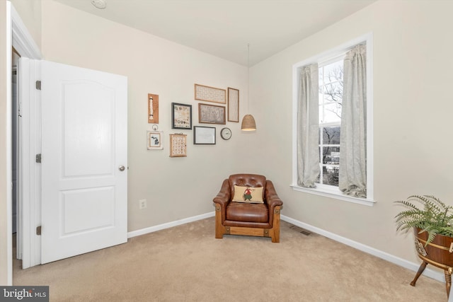 living area with light colored carpet