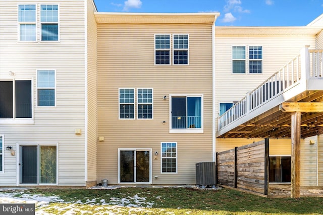 rear view of property featuring cooling unit