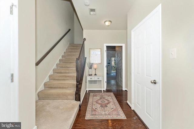 foyer featuring dark wood-type flooring