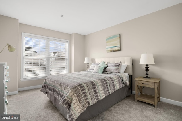 carpeted bedroom with baseboards